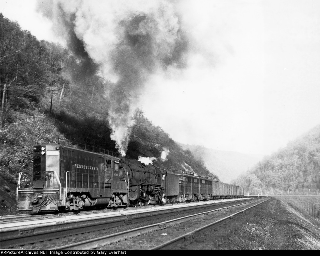 Rare PRR GP7 #8798 heads up a steam & diesel lashup 